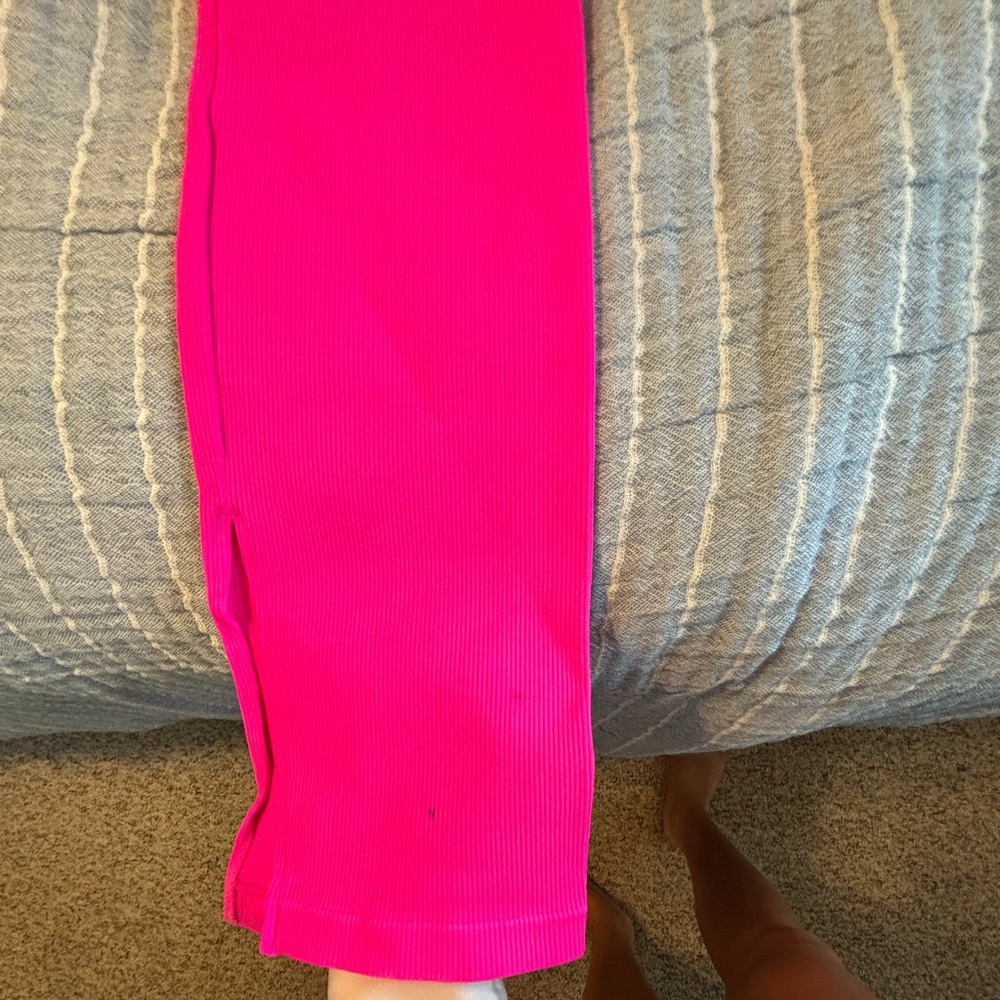 large. Yoga pants with slitted bottom. 2 dots on bottom in great condition